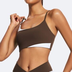 Woman wearing recycled colorblock cami sports bra with asymmetric chest trim