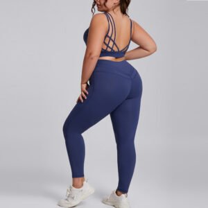Plus size model wearing two piece plus size yoga co-ords set in navy blue