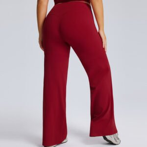Back view of burgundy plus size straight leg yoga pants on model