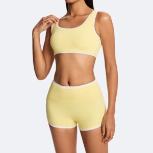 Woman wearing custom contrast trim yoga short set for workout