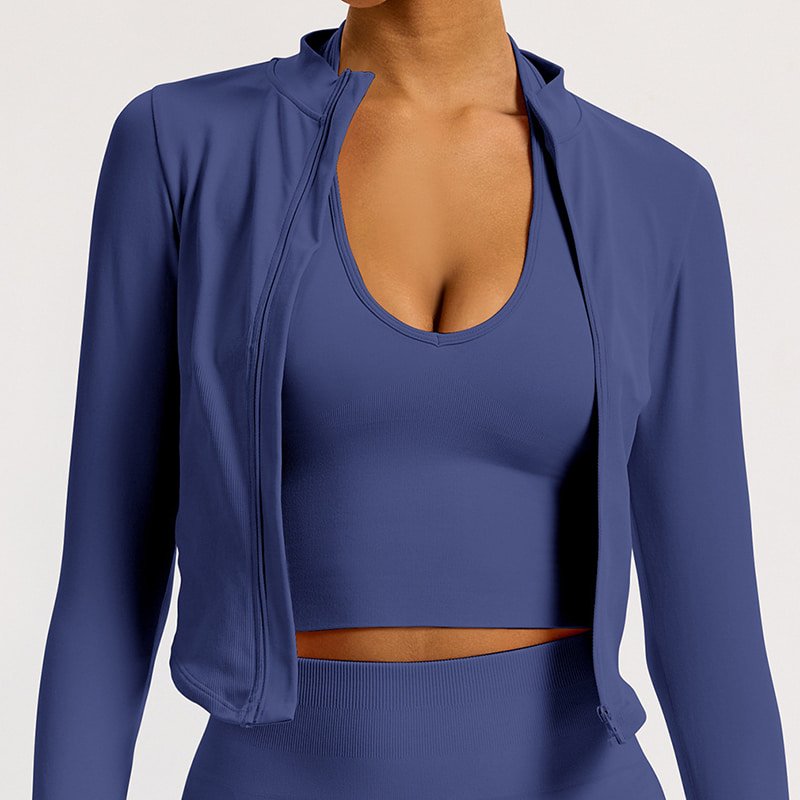 Custom Seamless Full Zip Yoga Jacket with Thumb Holes W8022 8 Women wearing a blue seamless full zip yoga jacket with stand collar