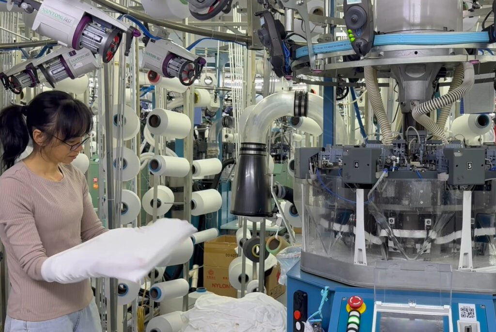 How We Ensure Light-Colored Yoga Leggings Stay Squat-Proof Before Bulk Production? 2 Santoni seamless knitting machine calibrating tension for activewear