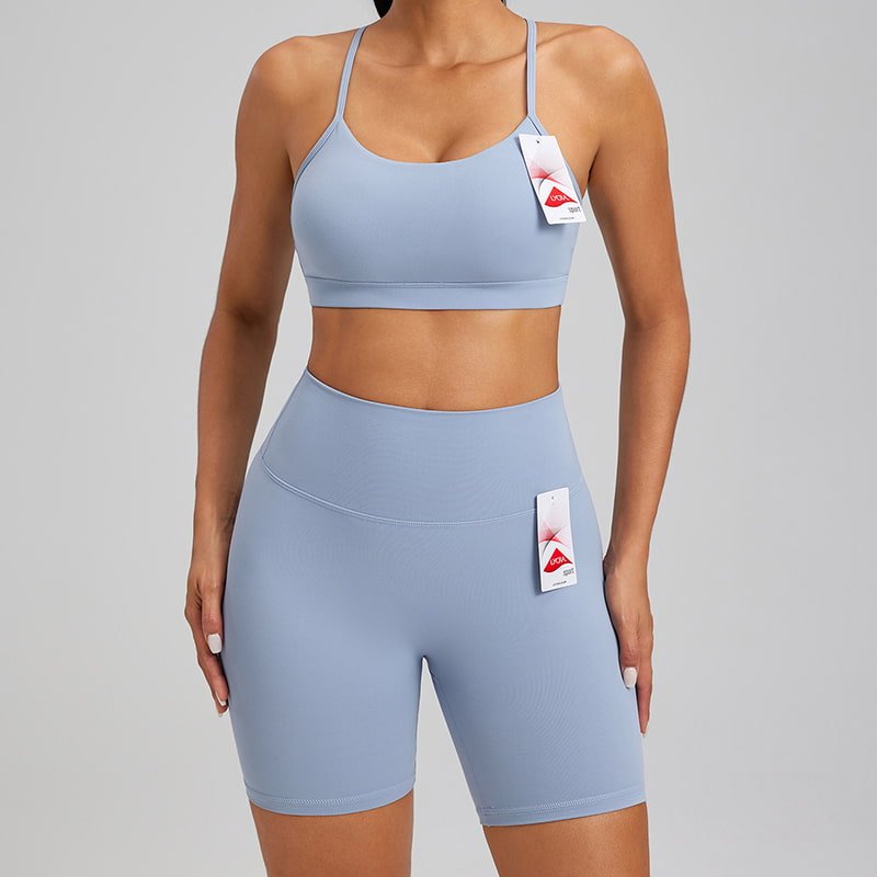 Wholesale Custom 2 Piece Lycra Workout Set - Naked Feel Sports Bra F231 & Biker Shorts F232 1 Woman wearing a blue 2 piece Lycra workout set with a sports bra and biker shorts